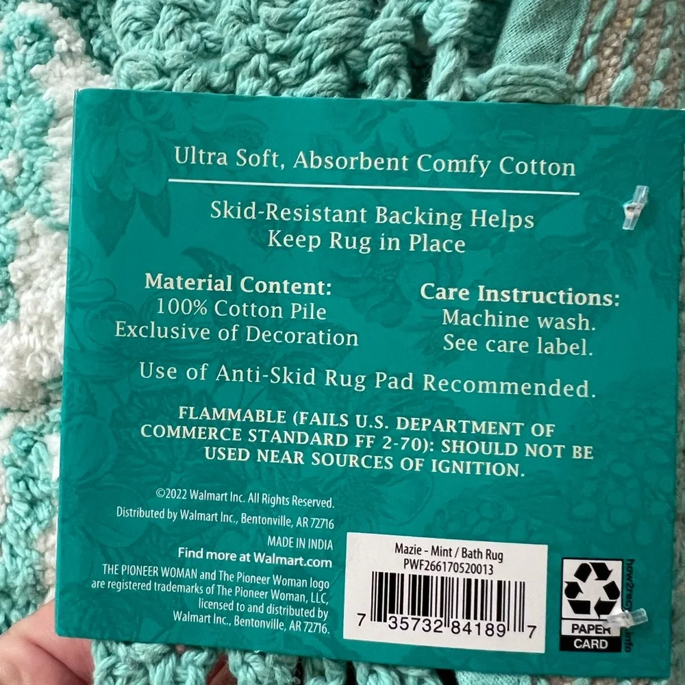 The Pioneer Woman “Mazie” round bath rug.